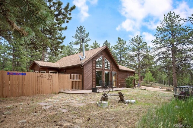 21 Crystal Rock Rd, Bailey, CO 80421 - rear view of house featuring roof with shingles