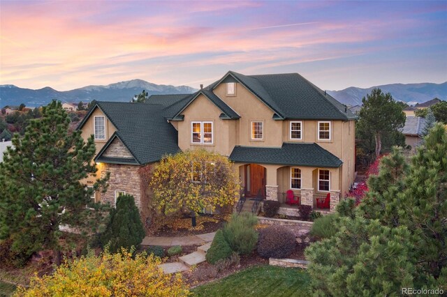 view of front of house featuring a porch and a mountain view