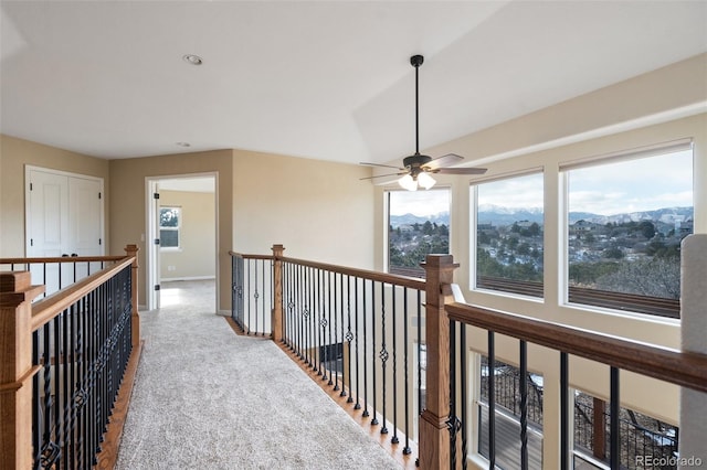 hallway with carpet and a mountain view