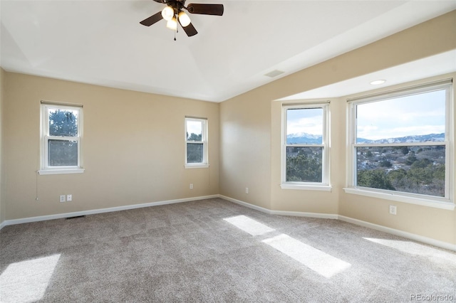 unfurnished room featuring ceiling fan and light colored carpet