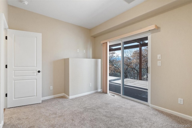 empty room with light colored carpet