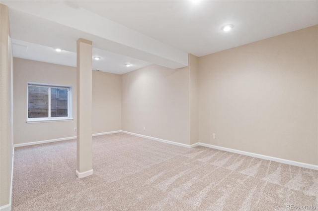 basement featuring light colored carpet