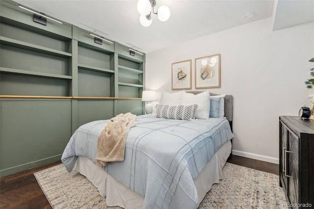 517 Chiswick Cir, Highlands Ranch, CO 80126 - bedroom featuring baseboards and wood finished floors