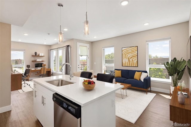 2374 S University Blvd Unit 202, Denver, CO 80210 - kitchen with dishwasher, open floor plan, a sink, wood finished floors, and recessed lighting