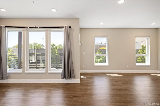 2374 S University Blvd Unit 202, Denver, CO 80210 - empty room featuring wood finished floors, baseboards, and recessed lighting