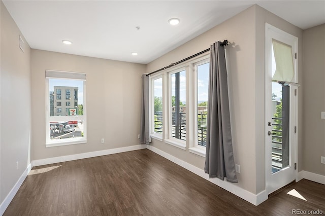 2374 S University Blvd Unit 202, Denver, CO 80210 - unfurnished room with dark wood finished floors, baseboards, and recessed lighting