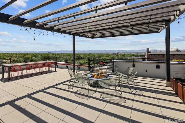 2374 S University Blvd Unit 202, Denver, CO 80210 - view of patio with a pergola and a mountain view