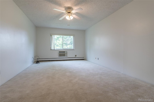 unfurnished room featuring light carpet, a wall mounted AC, a baseboard heating unit, ceiling fan, and a textured ceiling