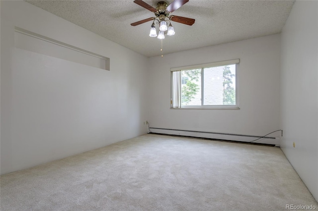 carpeted empty room featuring ceiling fan, baseboard heating, and a textured ceiling