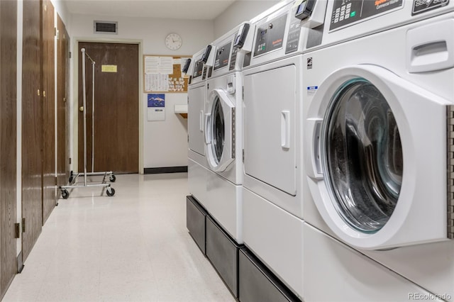 laundry area with washing machine and dryer