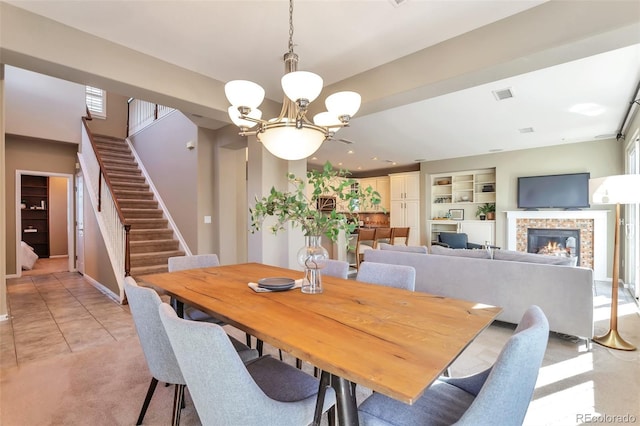 tiled dining space with a notable chandelier