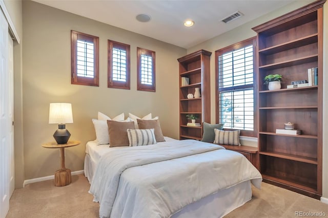 bedroom with light carpet