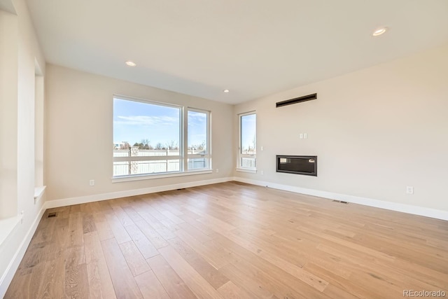 unfurnished living room featuring light hardwood / wood-style flooring