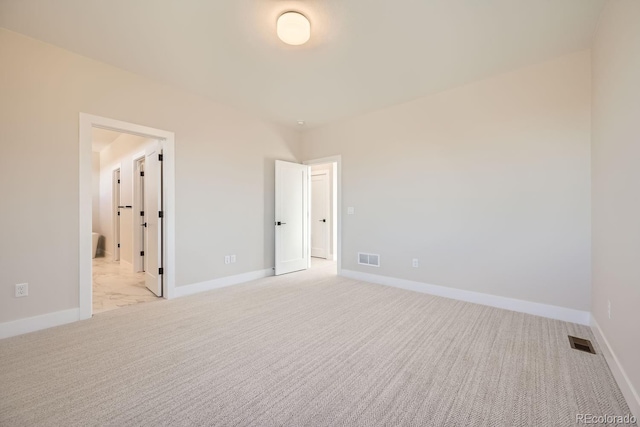 unfurnished bedroom with light colored carpet