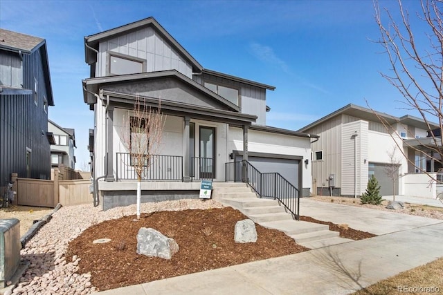 5604 Grandville Ave, Longmont, CO 80503 - view of front of property featuring a porch, a garage, and driveway