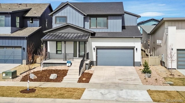 5604 Grandville Ave, Longmont, CO 80503 - modern inspired farmhouse featuring a standing seam roof, a garage, covered porch, a shingled roof, and concrete driveway