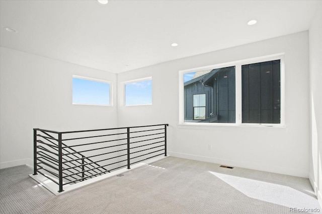 5604 Grandville Ave, Longmont, CO 80503 - spare room with carpet flooring, visible vents, and baseboards