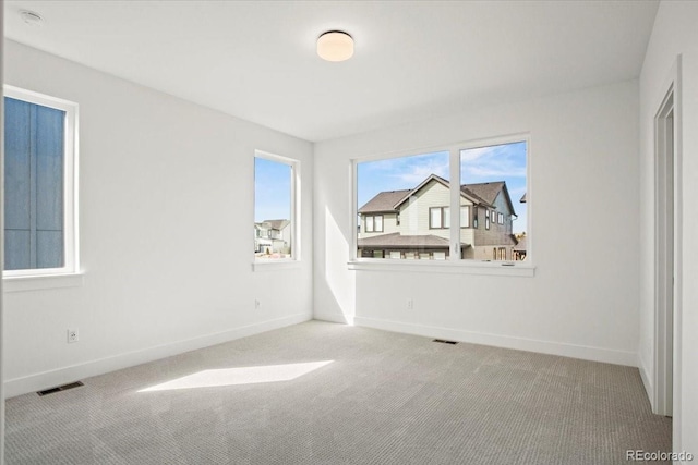 5604 Grandville Ave, Longmont, CO 80503 - empty room with carpet, visible vents, and baseboards
