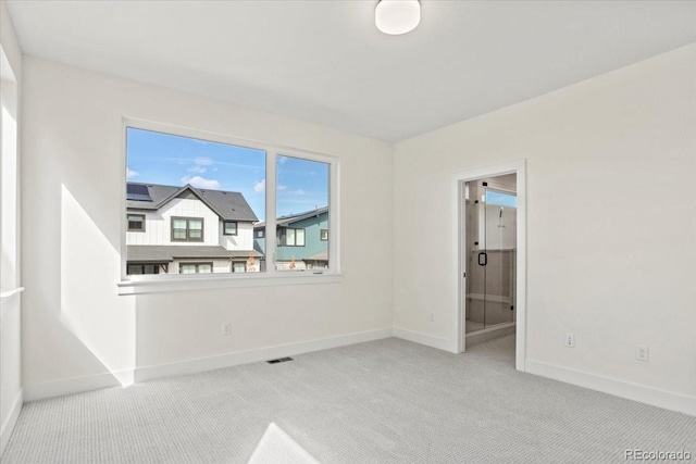 5604 Grandville Ave, Longmont, CO 80503 - carpeted spare room with visible vents and baseboards