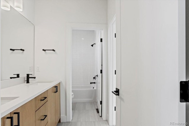 5604 Grandville Ave, Longmont, CO 80503 - full bath featuring a sink, toilet, double vanity, and  shower combination
