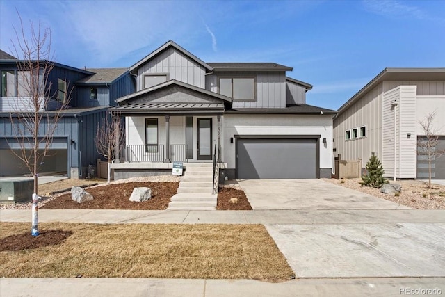 5604 Grandville Ave, Longmont, CO 80503 - view of front of property featuring concrete driveway, board and batten siding, a porch, a standing seam roof, and metal roof