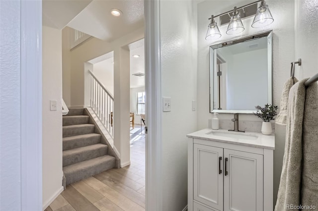 bathroom featuring wood-type flooring and vanity