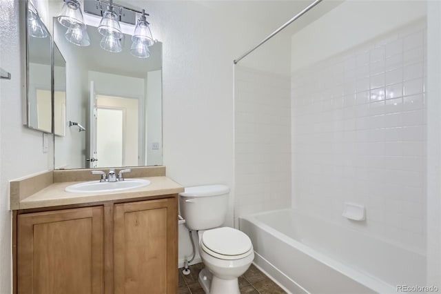 full bathroom featuring toilet, vanity, tile patterned floors, and shower / tub combination