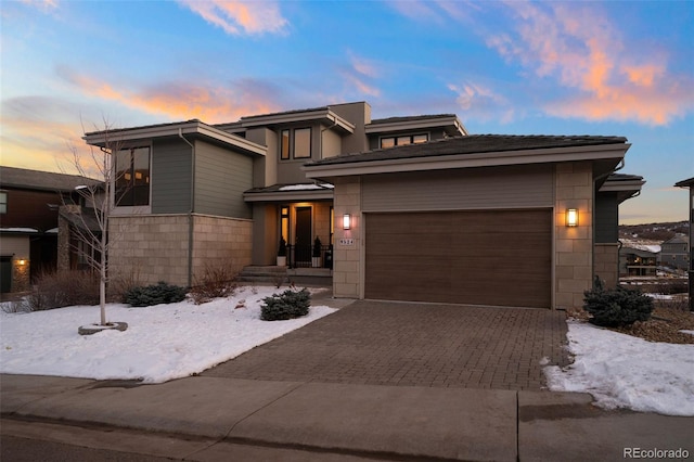 prairie-style home featuring a garage