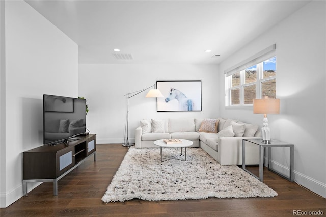 living room with dark wood-type flooring