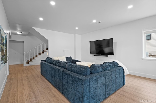 living room with light hardwood / wood-style flooring