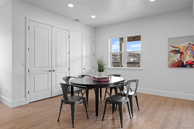 dining room with light wood-type flooring