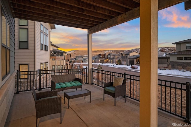 snow covered back of property featuring outdoor lounge area