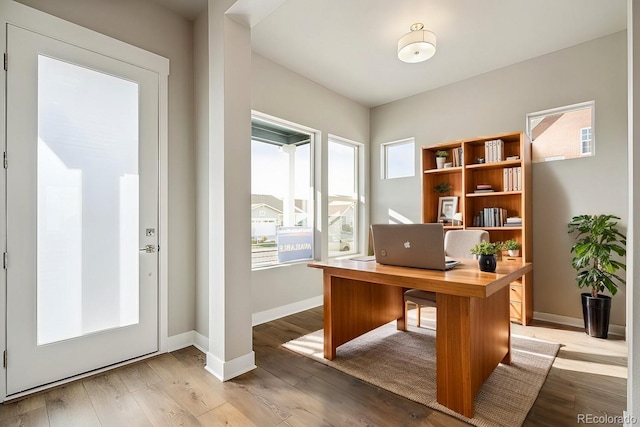 office with light wood finished floors and baseboards