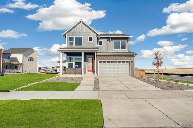 21295 E 61st Dr, Aurora, CO 80019 - craftsman house featuring a front lawn, driveway, board and batten siding, covered porch, and an attached garage