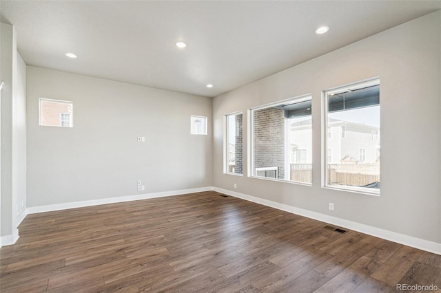 21295 E 61st Dr, Aurora, CO 80019 - empty room featuring recessed lighting, visible vents, baseboards, and dark wood-style flooring