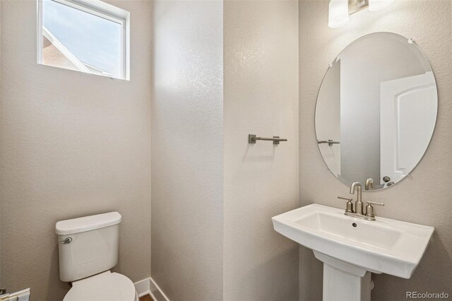 21295 E 61st Dr, Aurora, CO 80019 - bathroom featuring a sink and toilet