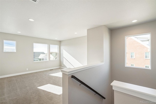 21295 E 61st Dr, Aurora, CO 80019 - empty room featuring carpet, a wealth of natural light, and recessed lighting