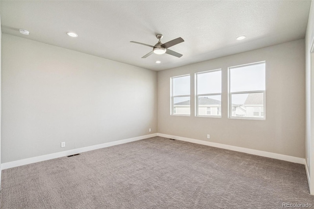 21295 E 61st Dr, Aurora, CO 80019 - unfurnished room featuring visible vents, baseboards, recessed lighting, ceiling fan, and carpet floors