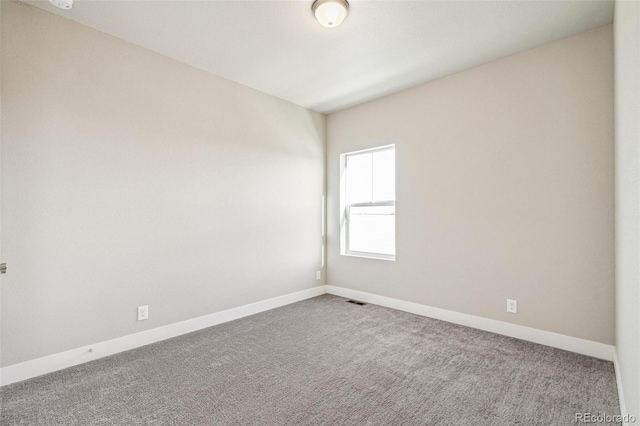 21295 E 61st Dr, Aurora, CO 80019 - carpeted empty room featuring visible vents and baseboards
