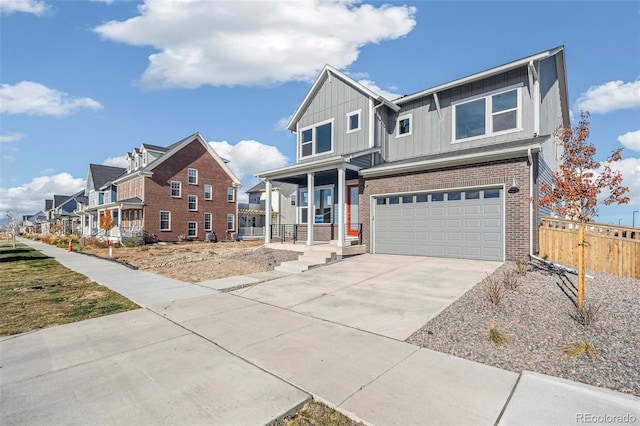 21295 E 61st Dr, Aurora, CO 80019 - view of front of home with fence, board and batten siding, an attached garage, driveway, and a porch