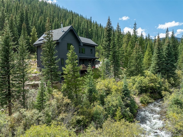 379 Rainbow Rd, Idaho Springs, CO 80452 - view of side of home with a forest view