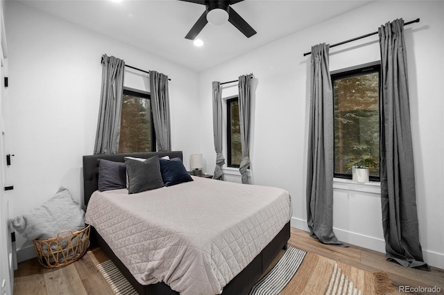 379 Rainbow Rd, Idaho Springs, CO 80452 - bedroom with multiple windows, light wood-type flooring, recessed lighting, and baseboards