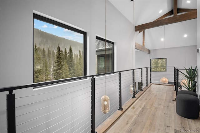 379 Rainbow Rd, Idaho Springs, CO 80452 - corridor with beam ceiling, wood-type flooring, high vaulted ceiling, and healthy amount of natural light