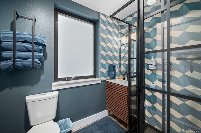 379 Rainbow Rd, Idaho Springs, CO 80452 - bathroom featuring a stall shower, toilet, and a sink