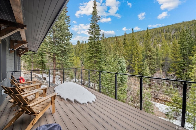 379 Rainbow Rd, Idaho Springs, CO 80452 - wooden terrace featuring a view of trees