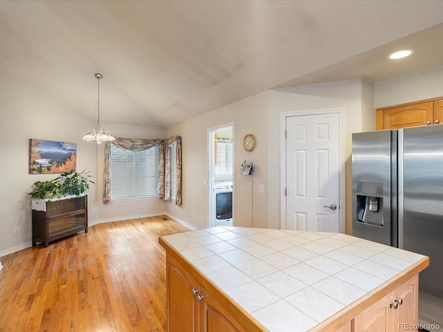 7158 W Belmont Dr, Littleton, CO 80123 - kitchen featuring stainless steel fridge with ice dispenser, tile counters, baseboards, and a notable chandelier