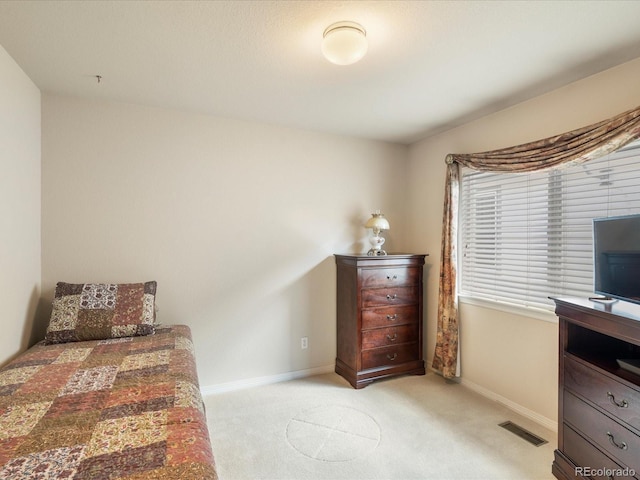 7158 W Belmont Dr, Littleton, CO 80123 - bedroom with baseboards, light colored carpet, and visible vents