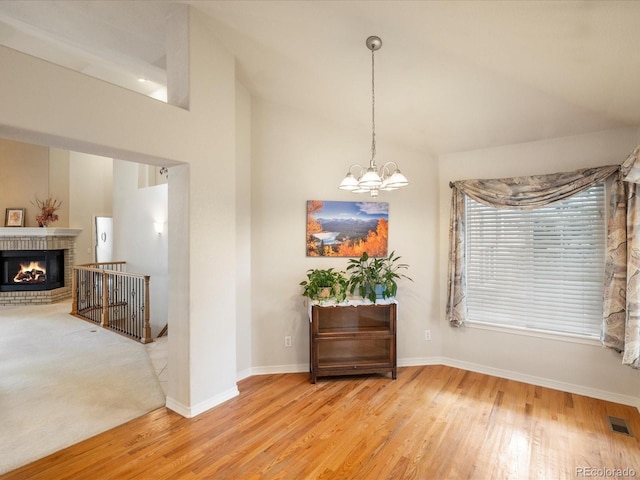 7158 W Belmont Dr, Littleton, CO 80123 - interior space featuring baseboards, a notable chandelier, visible vents, and wood finished floors