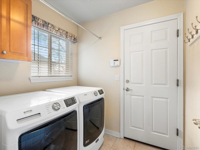 7158 W Belmont Dr, Littleton, CO 80123 - laundry room with light tile patterned floors, baseboards, cabinet space, and washing machine and clothes dryer