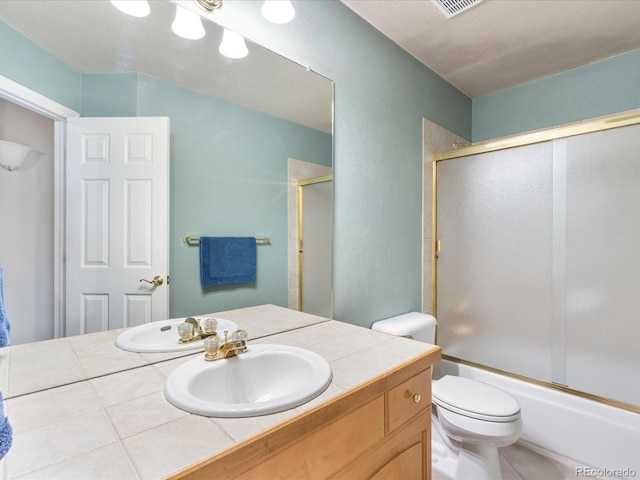 7158 W Belmont Dr, Littleton, CO 80123 - full bathroom featuring toilet, a textured wall, enclosed tub / shower combo, and vanity